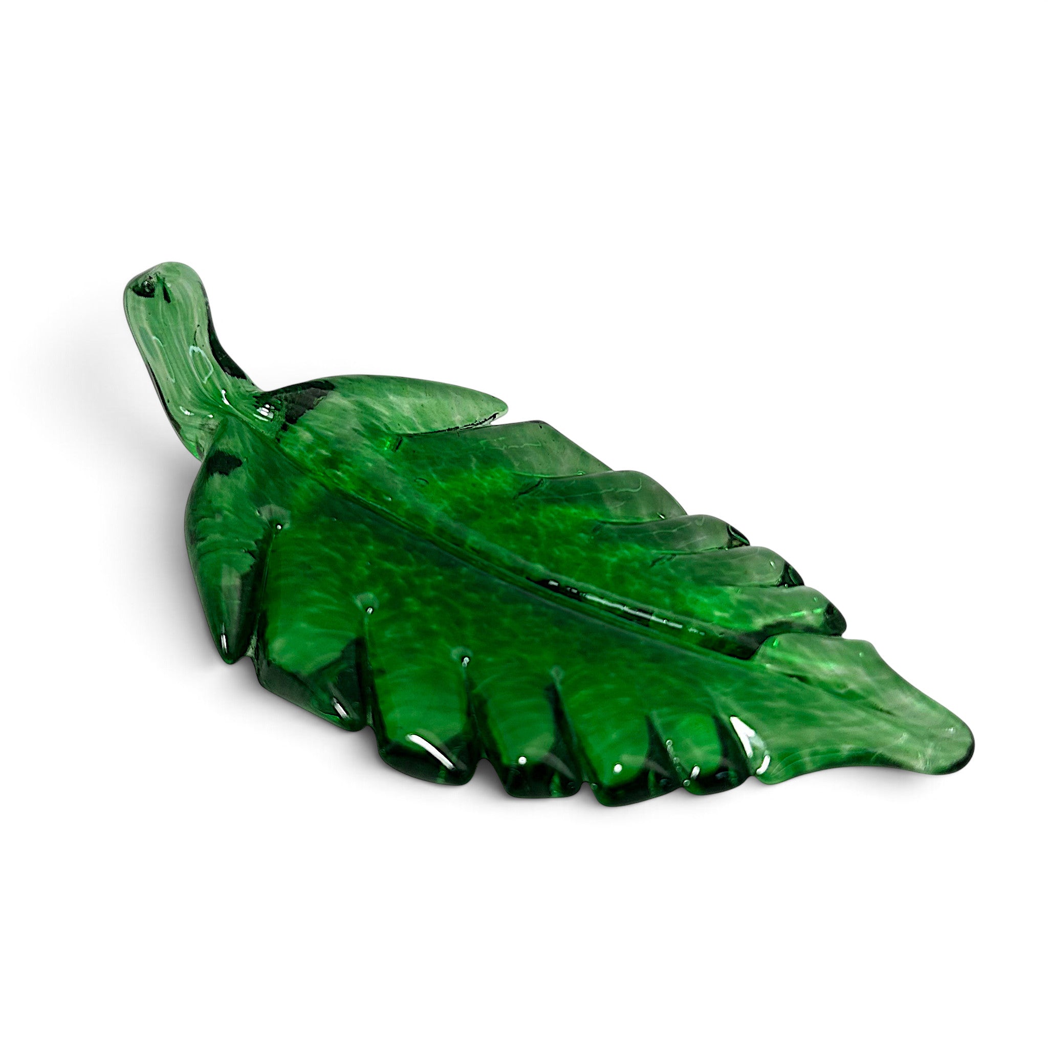 A handcrafted light green glass leaf sculpture with a textured, marbled pattern.      .