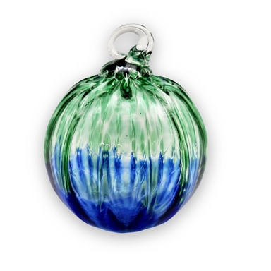 A blown glass ornament with ombre tones, featuring a lobed effect, and a clear glass hook at the top.