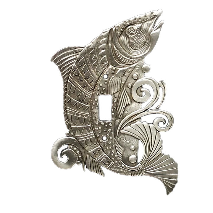 A pewter switch plate featuring an intricate salmon design with a shiny finish and a central switch hole.