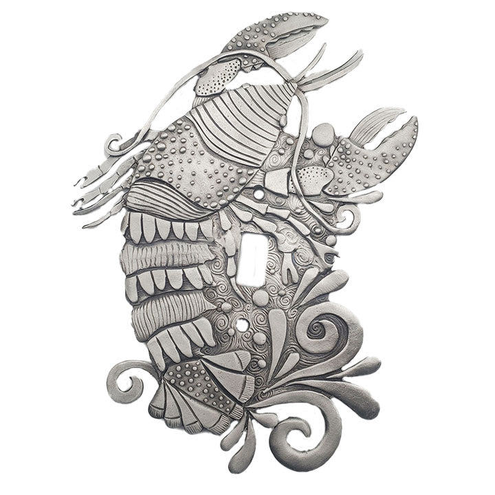 A silver-colored pewter switch plate with an intricate rock lobster design.