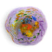 A reef bowl hand-blown glass art piece with a lavender-purple base and multicolored glass inclusions, including orange, yellow, green, blue, and black details.
