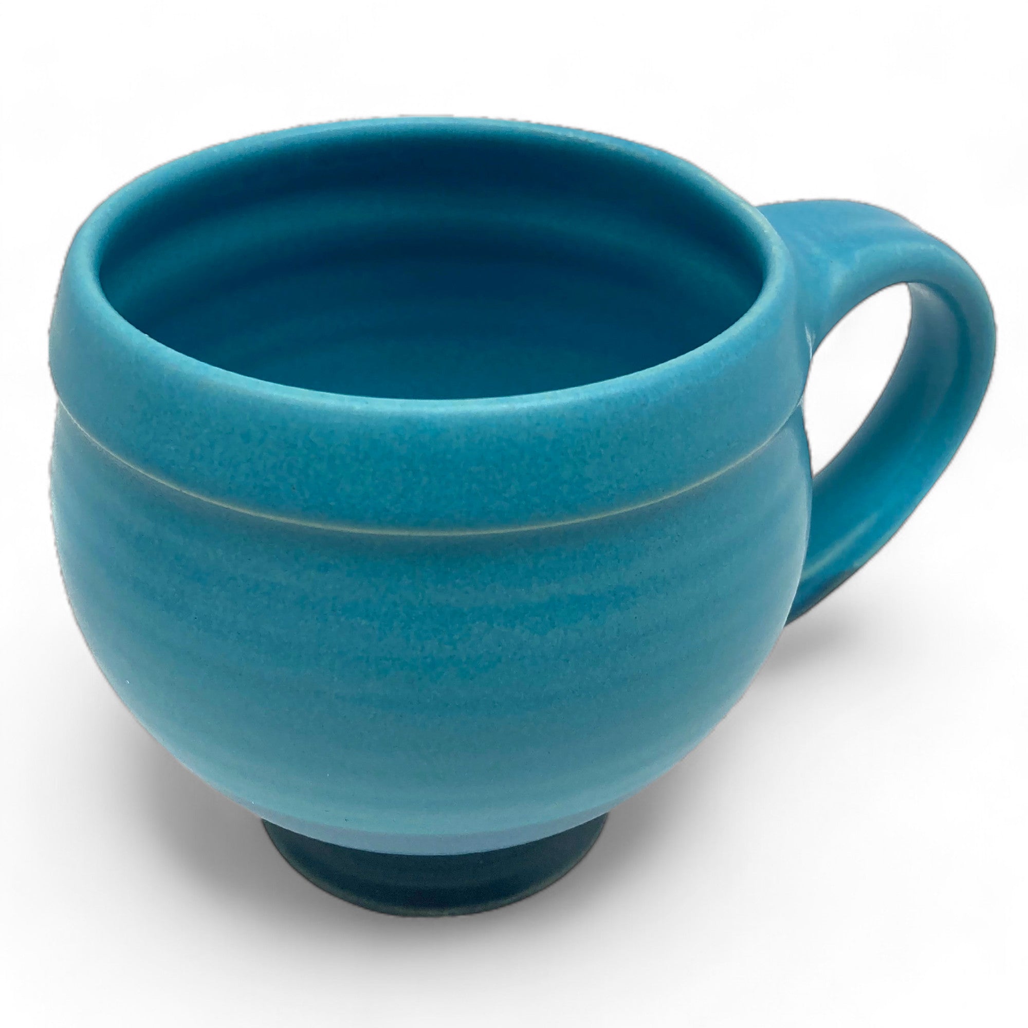 Handcrafted blue mug brings a burst of color to kitchen decor