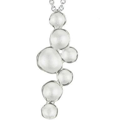 Silver bubble pendant necklace on a white background
