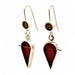 small teardrop shaped earrings crafted from sterling silver and red resin