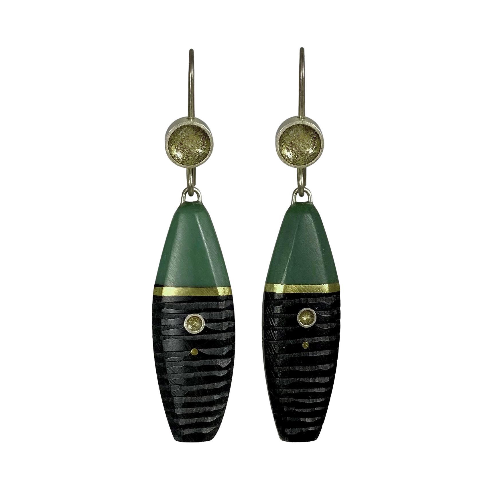 A pair of handcrafted earrings made from silver, gold fill, and cast and carved green resin, featuring a textured design and metallic accents.