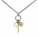 A trio of handcrafted charms complete this handcrafted necklace