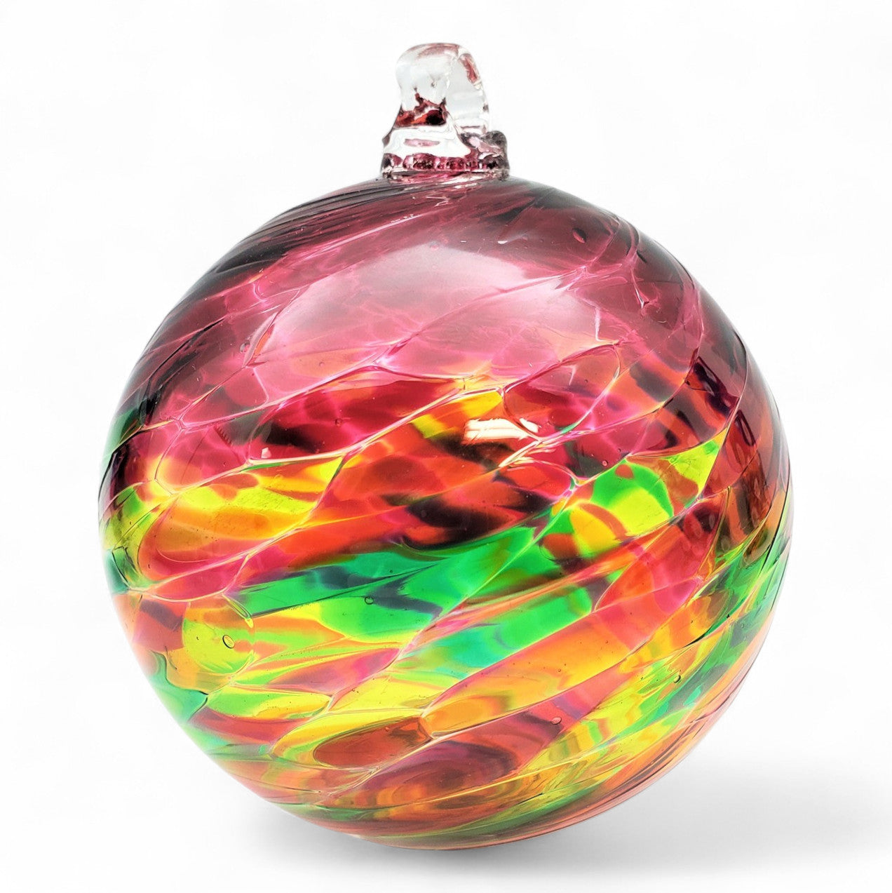 Colorful glass ornament with a multicolored swirl pattern on a white background