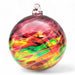 Colorful glass ornament with a multicolored swirl pattern on a white background
