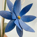 Blue lotus wildflower with a yellow center is crafted entirely by hand 