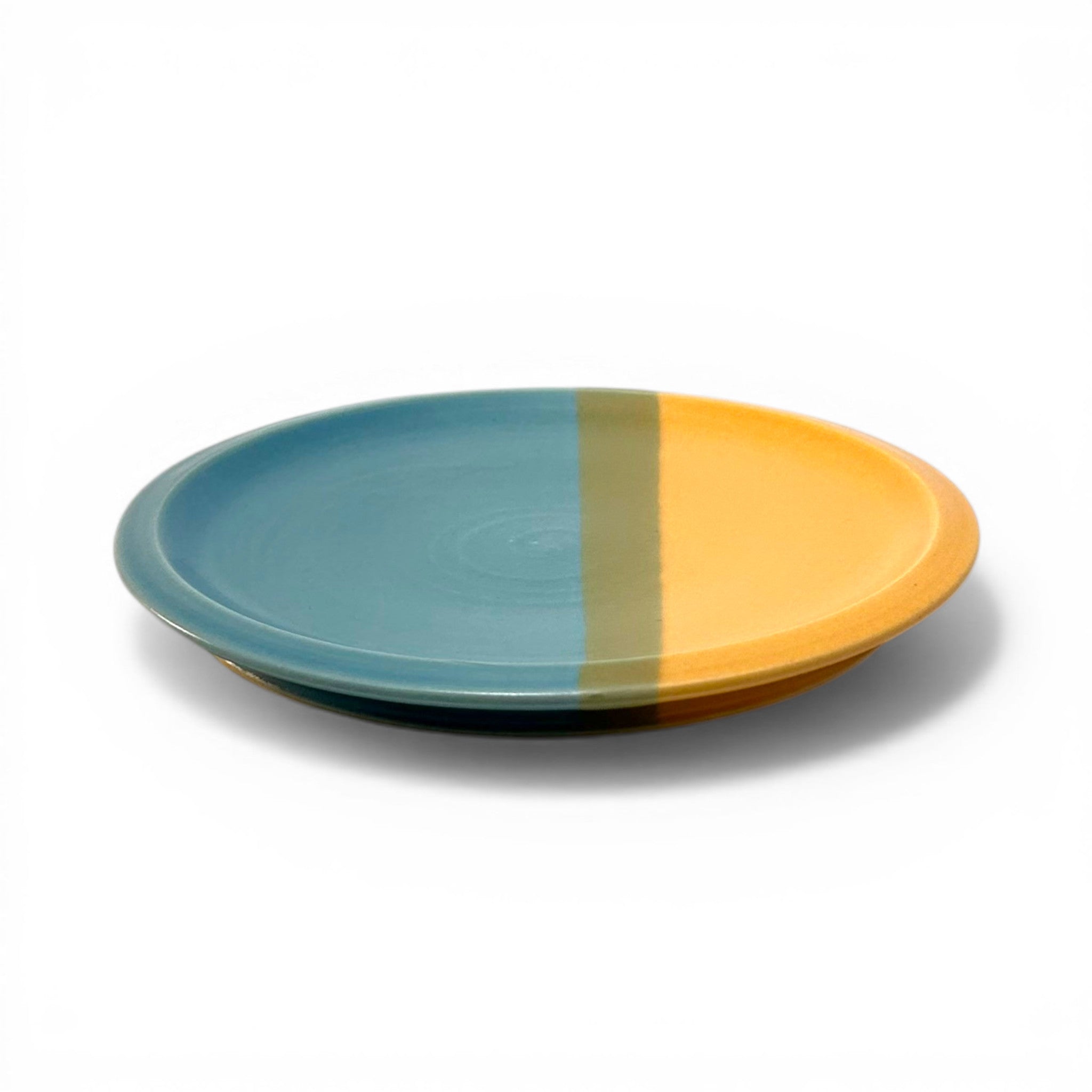 Two-tone blue and orange ceramic plate is a great colorful addition to a dinnerware collection