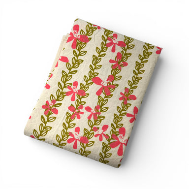 Folded kitchen towel 100% cotton fabric with a hand-printed pink floral pattern for spring color in your kitchen