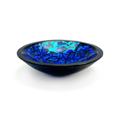 A round decorative glass bowl with a black exterior and blue interior, crafted from dichroic glass with a polished finish.