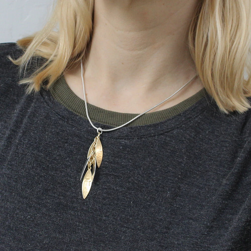 handcrafted layered leaves necklace on model