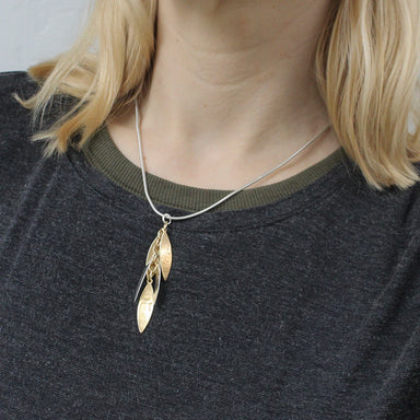 handcrafted layered leaves necklace on model