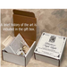 An open gift box and a closed square box for a nightlight. The gift box includes a brief history of the art.