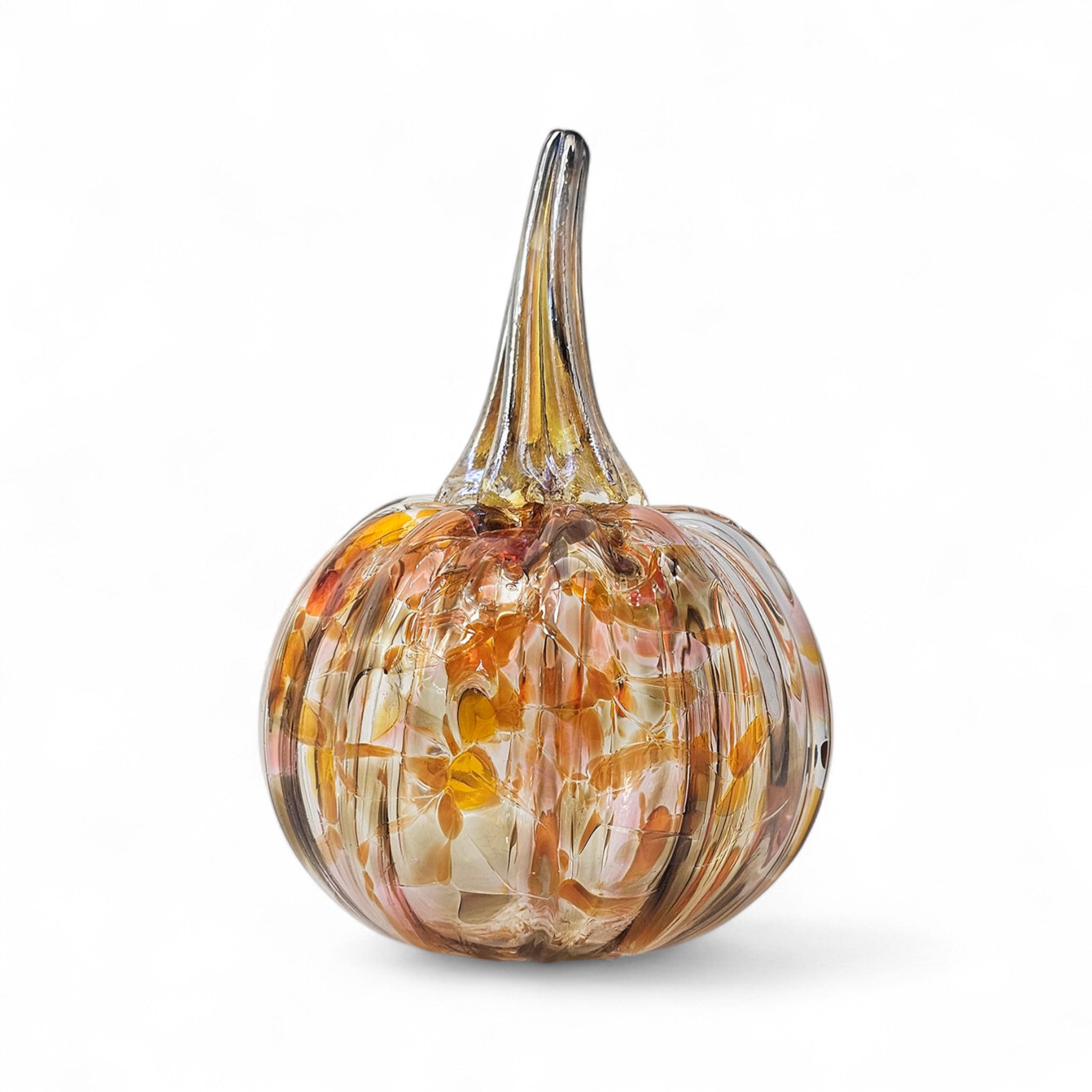Glass pumpkin with autumnal colors on a white background
