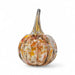 Glass pumpkin with autumnal colors on a white background