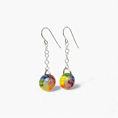 Colorful round earrings on a white background