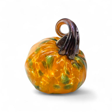Handcrafted petite glass pumpkin with a brown stem on a white background