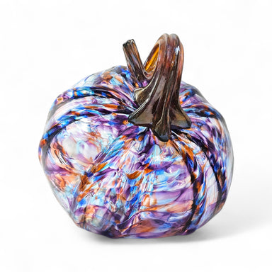 Multicolored glass pumpkin on a white background