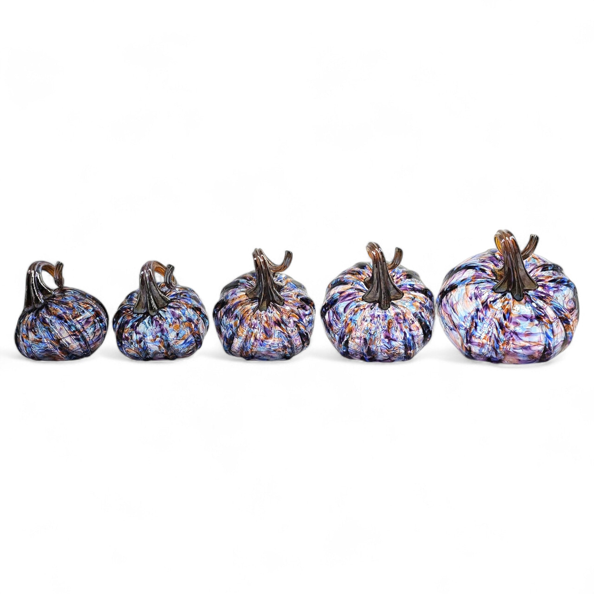 Set of five multicolored pumpkins on a white background