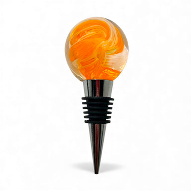 Wine bottle stopper with orange and yellow swirl design on a white background