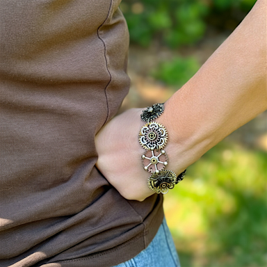 decorative steampunk bracelet with a blurred green background