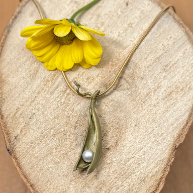 handcrafted pea pod necklace with one pearl is a modern take on botanical spring jewelry