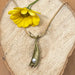 handcrafted pea pod necklace with one pearl is a modern take on botanical spring jewelry