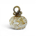 A handcrafted glass pumpkin with a ribbed bulbous body, a twisted loop handle, and embedded gold leaf details.