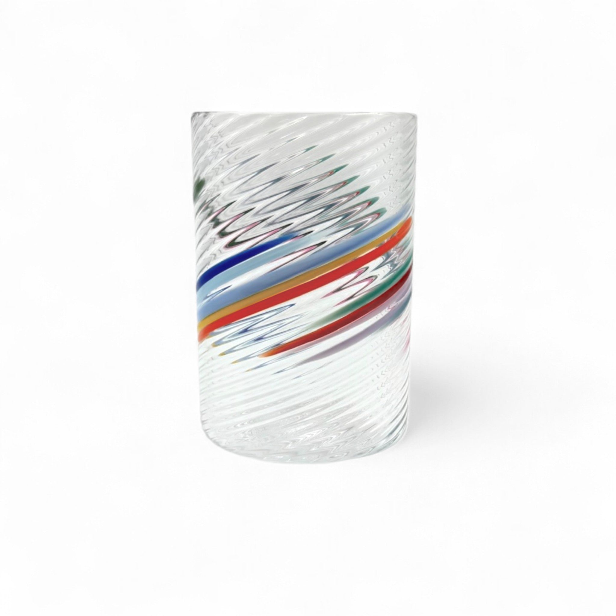 Clear glass with colorful ribbons on a white background