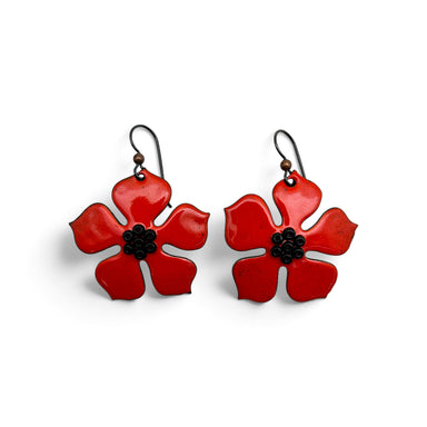 A pair of red enamel flower drop earrings with black centers and niobium earwires wires.