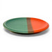 Two-tone green and red ceramic plate on is a colorful addition to your dinnerware