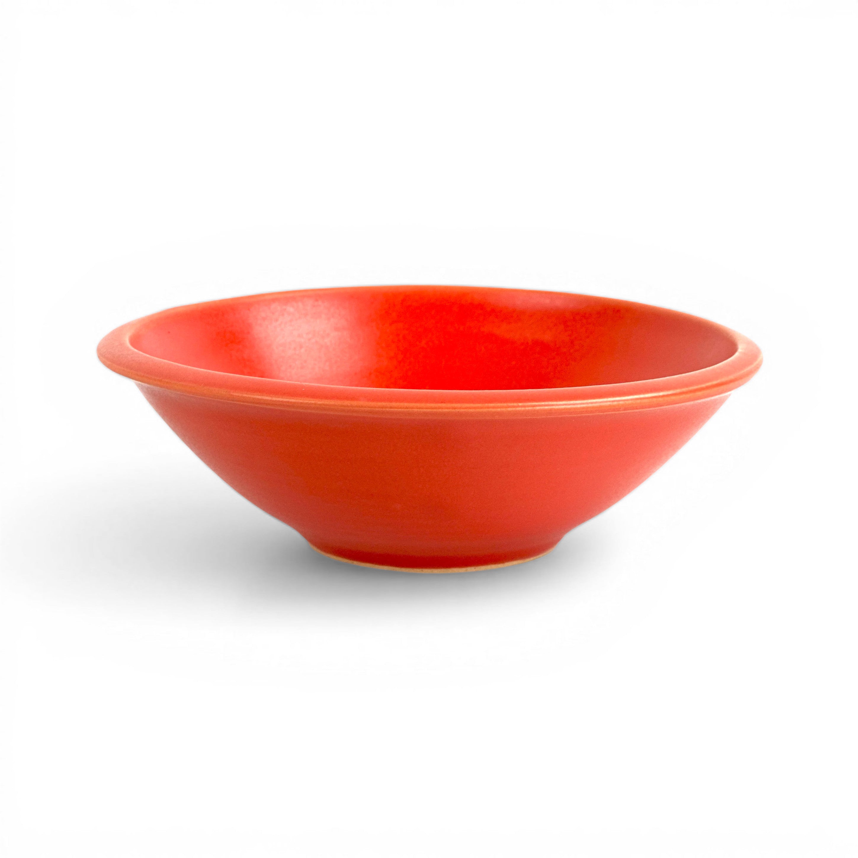 Handcrafted red cereal bowl is great for side salads, too