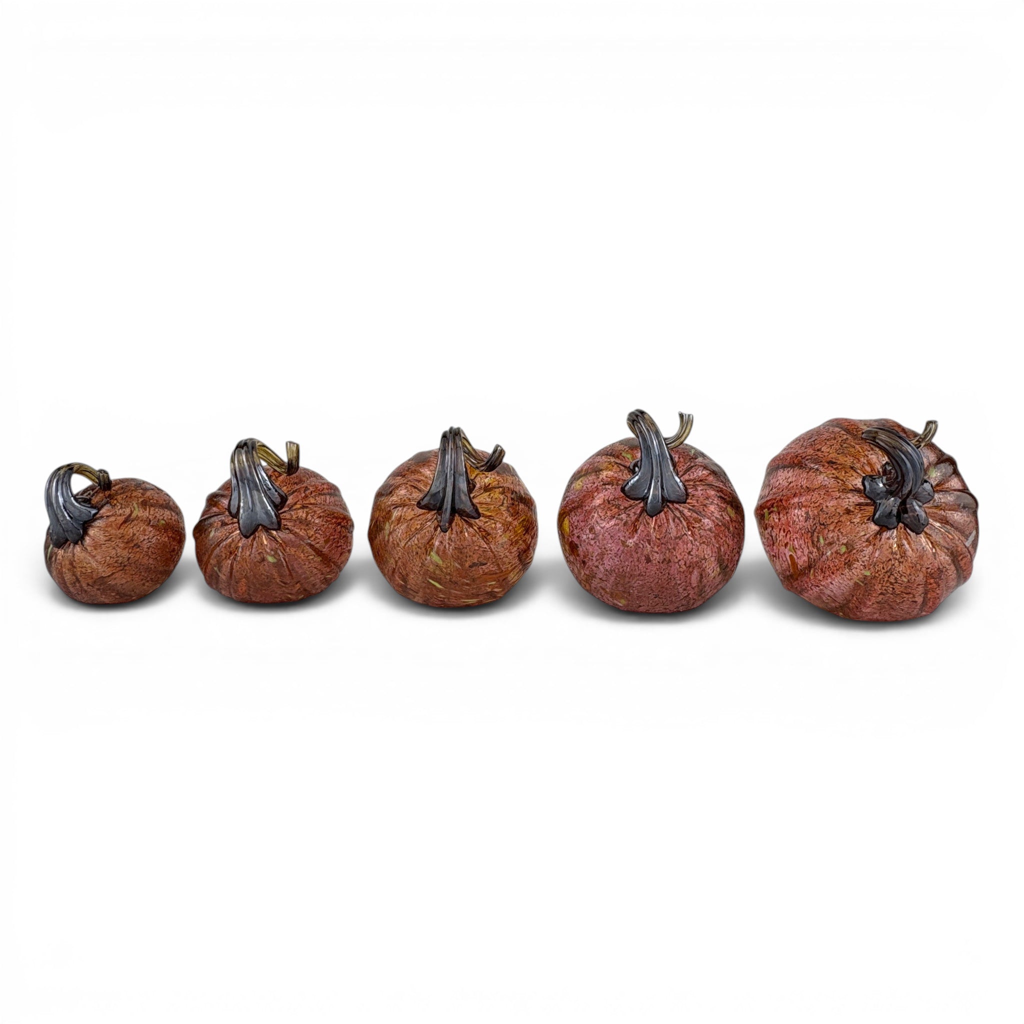 Five decorative glass pumpkins arranged in ascending size order on a plain white background.