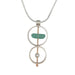 A brushed sterling silver and gold fill necklace with a pendant featuring naturally tumbled seaglass and an accent pearl, suspended from an 18-inch serpentine silver chain.