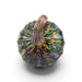 A faceted glass pumpkin with a ribbed handle, featuring an iridescent finish with rainbow reflections on a white background.