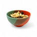 Colorful bowl with a mix of nuts on a white background