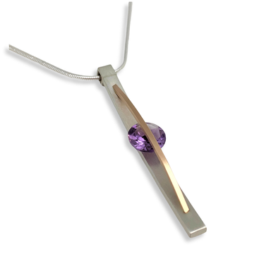 side view of a brushed sterling silver and gold-fill amethyst necklace