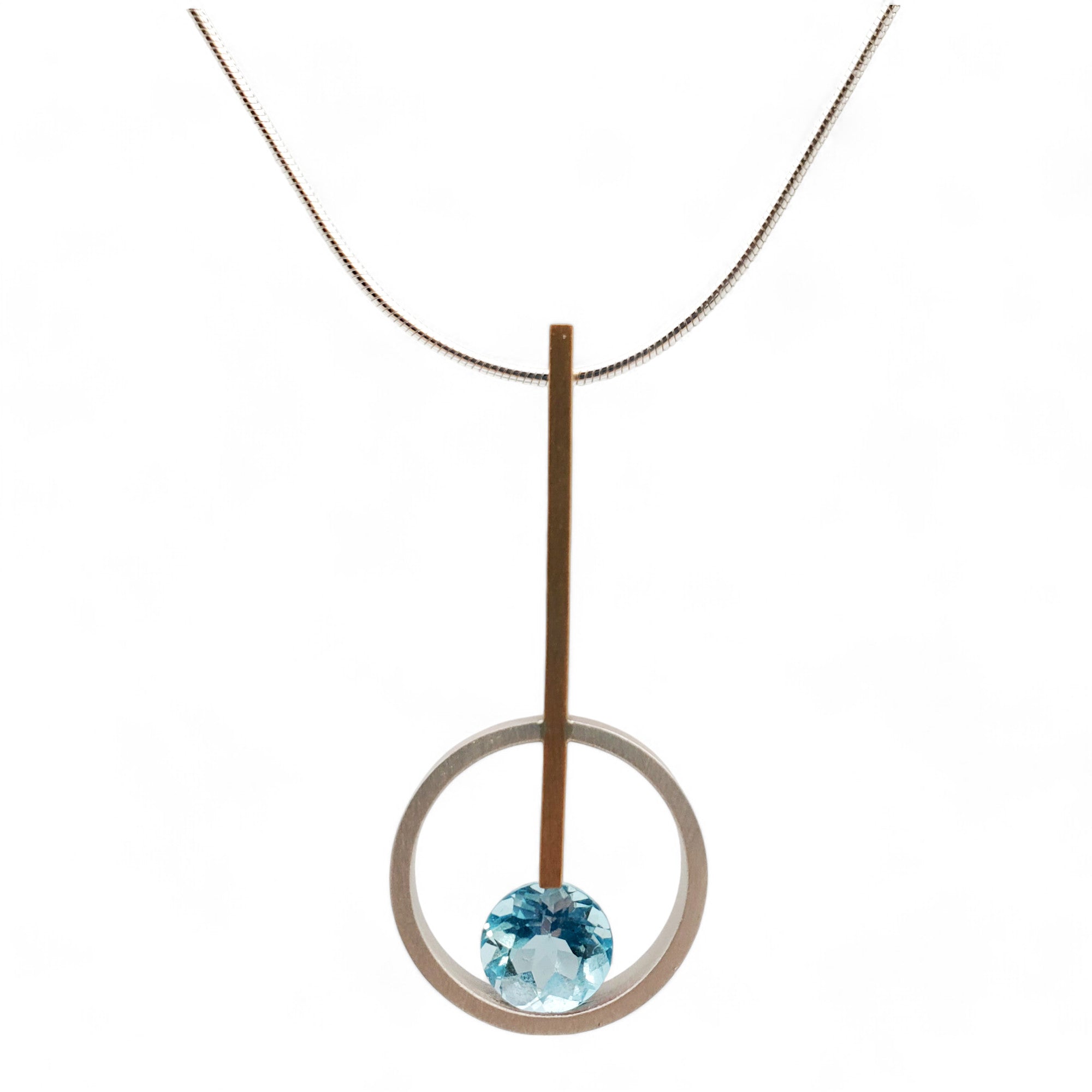 sterling silver and gold fill pendant with blue topaz on a sterling serpentine chain