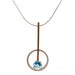 sterling silver and gold fill pendant with blue topaz on a sterling serpentine chain