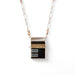 sterling silver and resin necklaced with blue and black accents on a hand-crafted silver chain