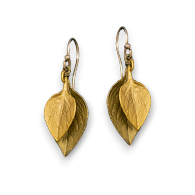 A pair of bronze earrings designed to resemble sweet basil leaves.