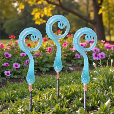 Handcrafted fiddlehead ferns created in teal glass. Get outdoors and enjoy the spring!