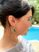 teal green handcrafted glass earrings with dichroic glass that shimmers in the light