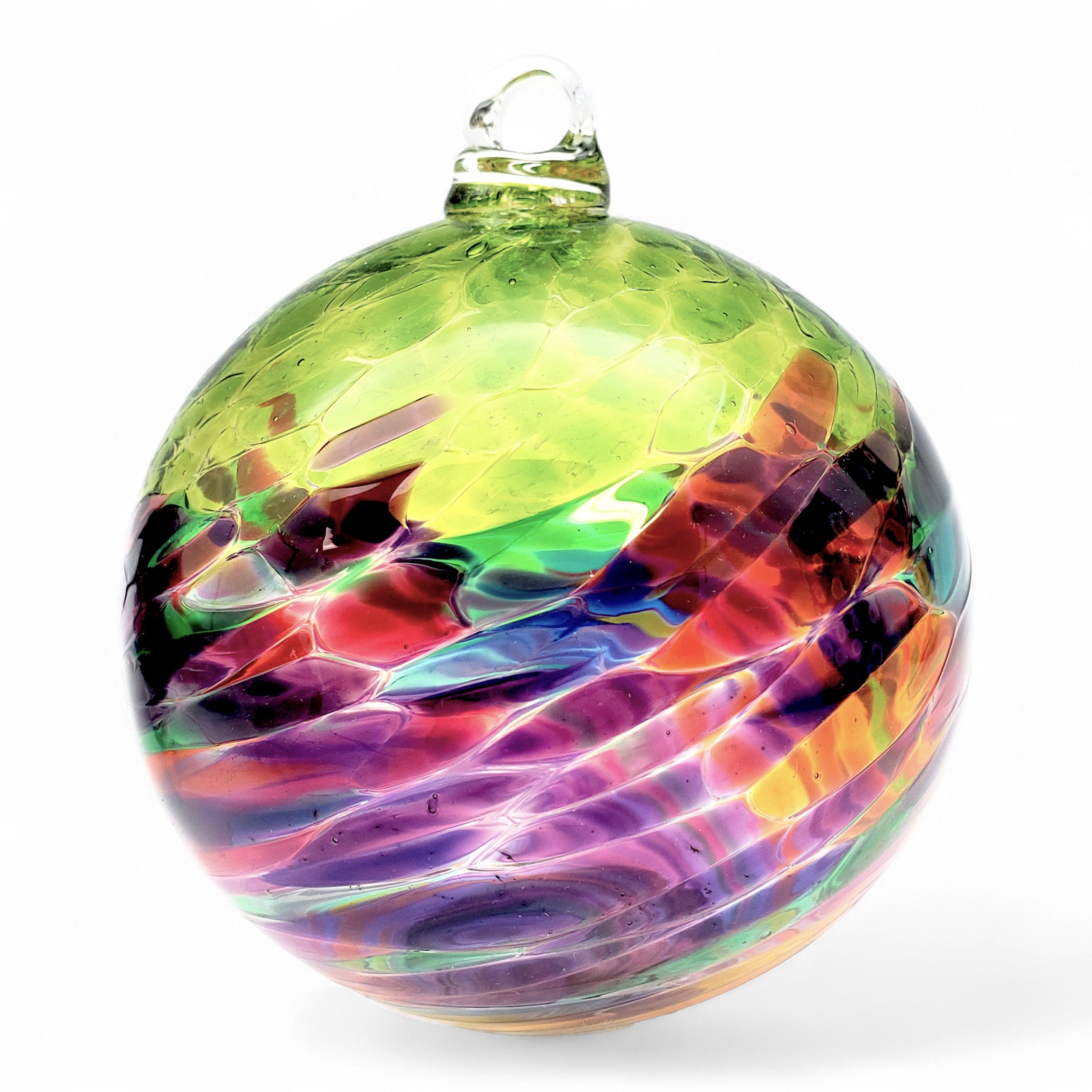 Multicolored glass ornament on a white background