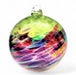 Multicolored glass ornament on a white background