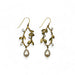 A pair of Victorian Vine oval earrings with bronze-colored metal and freshwater pearl accents.