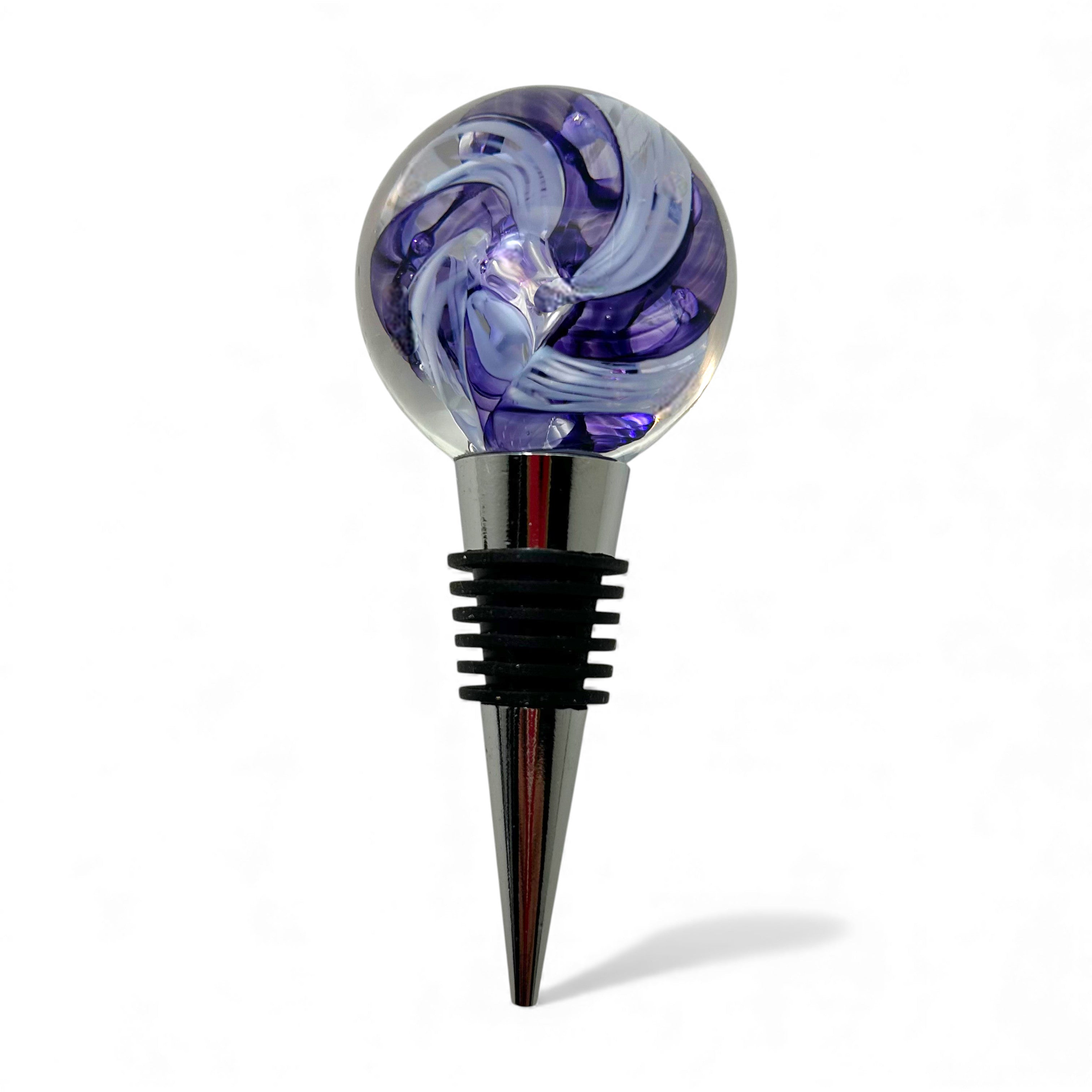 Decorative wine bottle stopper with purple and clear glass design on a white background