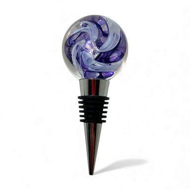 Decorative wine bottle stopper with purple and clear glass design on a white background